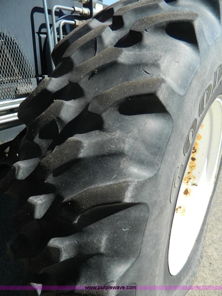 image for item E4189 2000 New Holland TV-140 bi-directional 4WD tractor