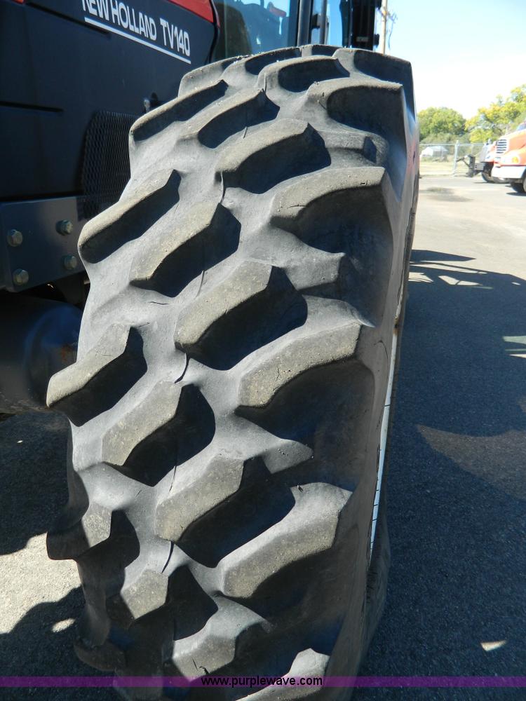 image for item E4189 2000 New Holland TV-140 bi-directional 4WD tractor