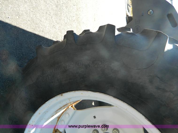 image for item E4189 2000 New Holland TV-140 bi-directional 4WD tractor