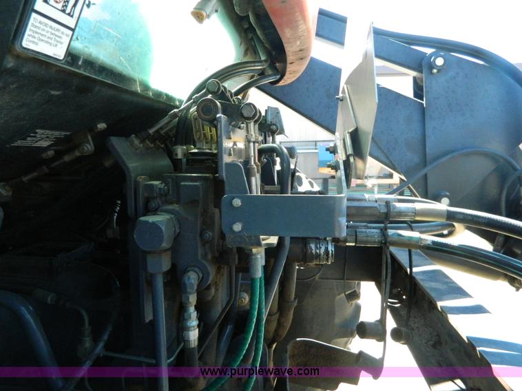 image for item E4189 2000 New Holland TV-140 bi-directional 4WD tractor