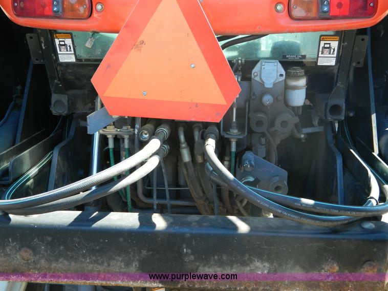 image for item E4189 2000 New Holland TV-140 bi-directional 4WD tractor