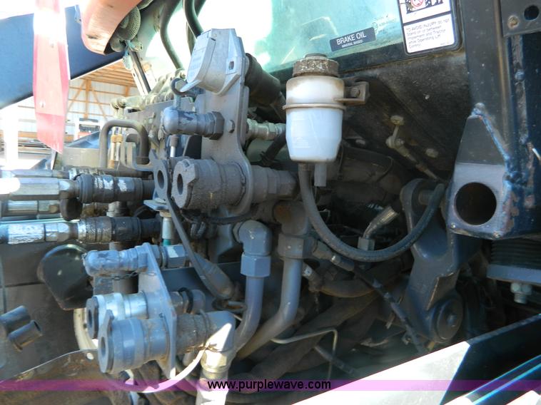 image for item E4189 2000 New Holland TV-140 bi-directional 4WD tractor