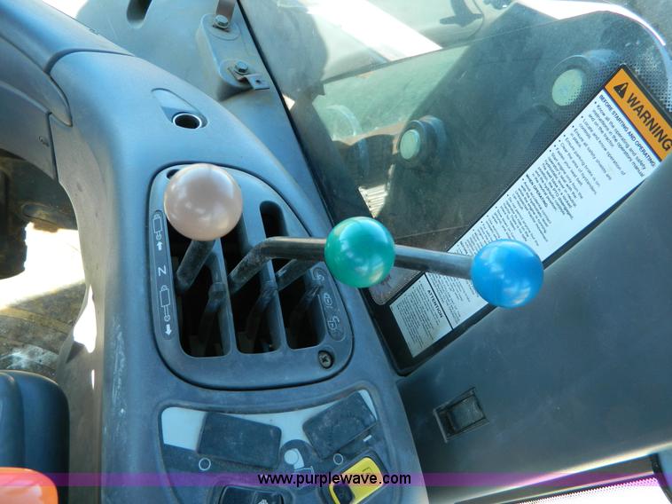 image for item E4189 2000 New Holland TV-140 bi-directional 4WD tractor