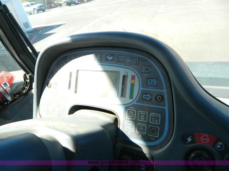 image for item E4189 2000 New Holland TV-140 bi-directional 4WD tractor