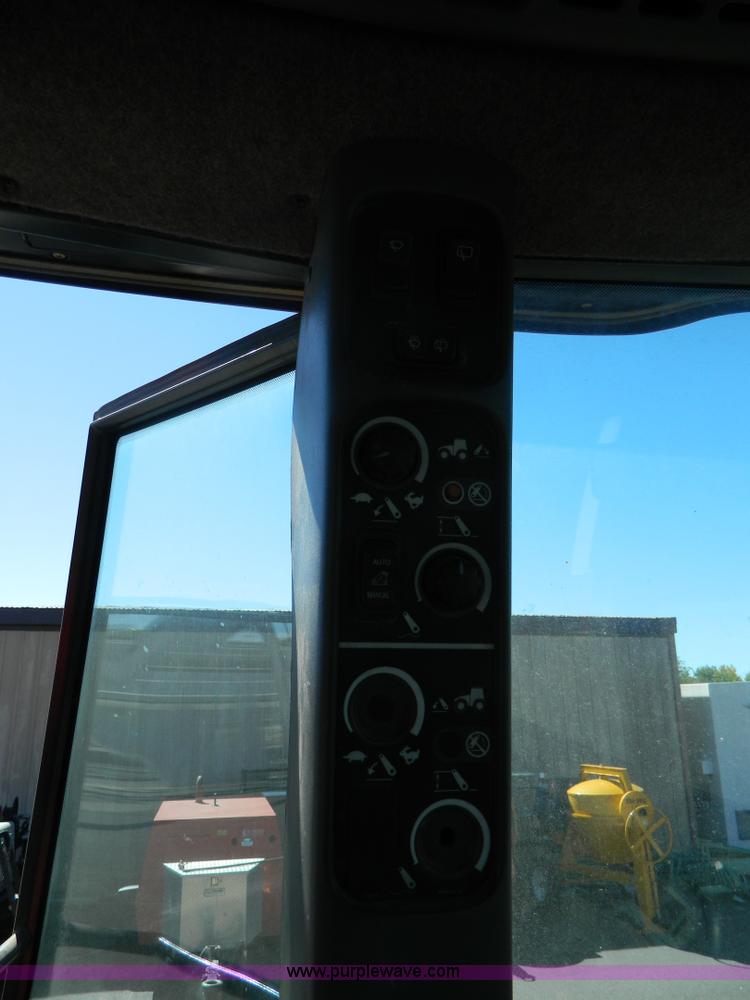 image for item E4189 2000 New Holland TV-140 bi-directional 4WD tractor