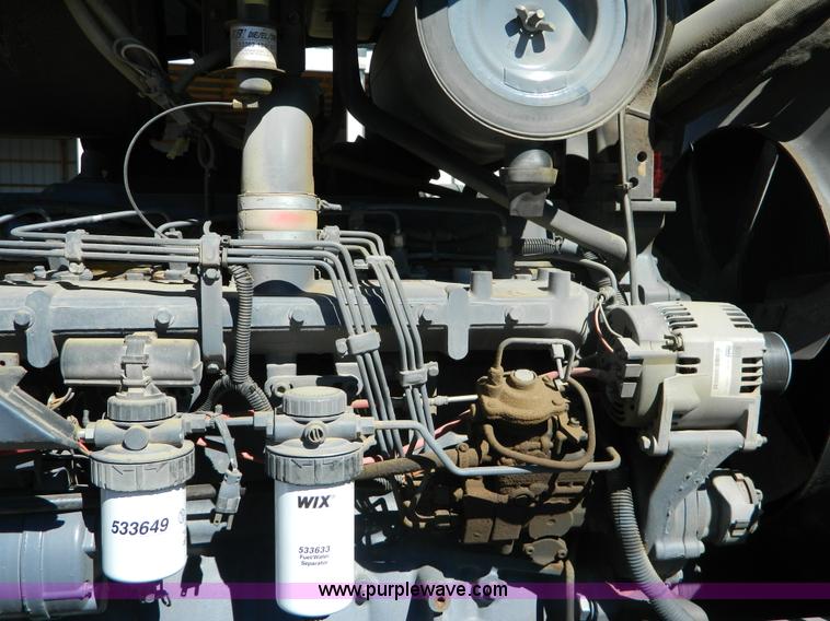 image for item E4189 2000 New Holland TV-140 bi-directional 4WD tractor