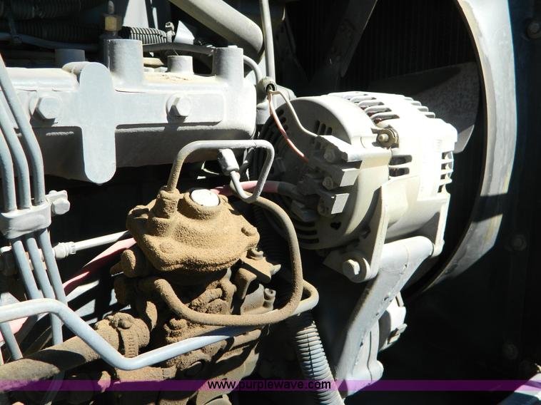 image for item E4189 2000 New Holland TV-140 bi-directional 4WD tractor