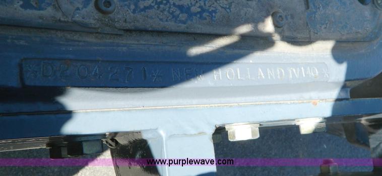 image for item E4189 2000 New Holland TV-140 bi-directional 4WD tractor