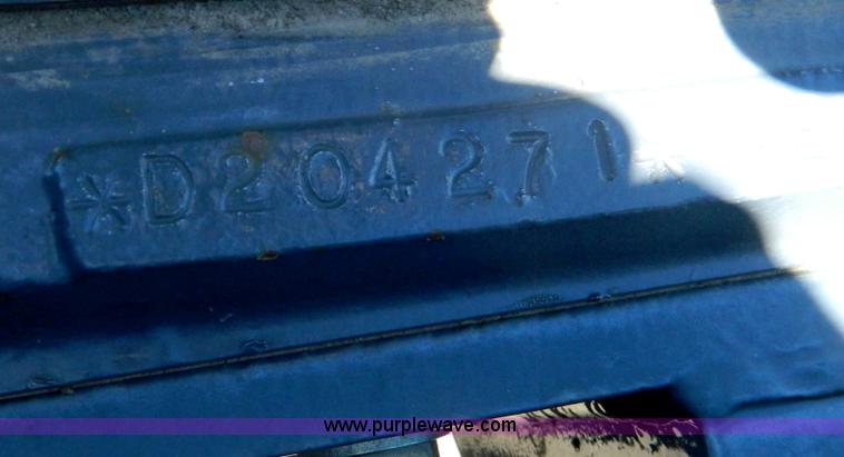 image for item E4189 2000 New Holland TV-140 bi-directional 4WD tractor