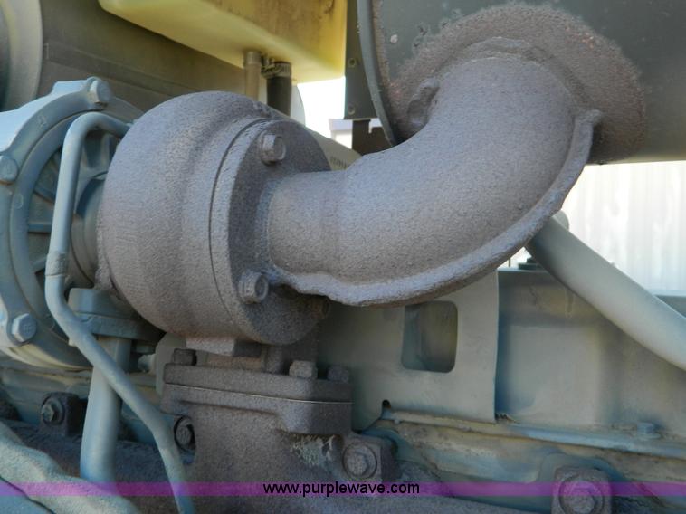 image for item E4189 2000 New Holland TV-140 bi-directional 4WD tractor