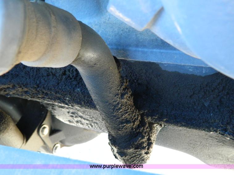 image for item E4189 2000 New Holland TV-140 bi-directional 4WD tractor