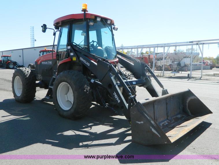 image for item E4190 2000 New Holland TV-140 bi-directional 4WD tractor
