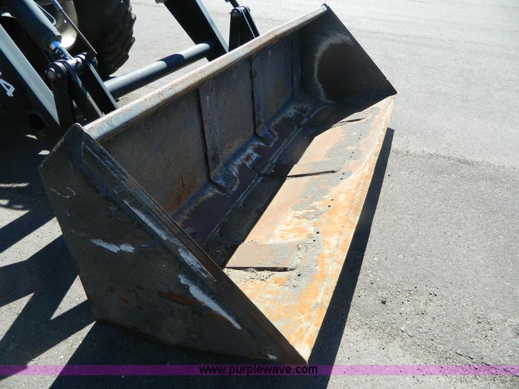 image for item E4190 2000 New Holland TV-140 bi-directional 4WD tractor