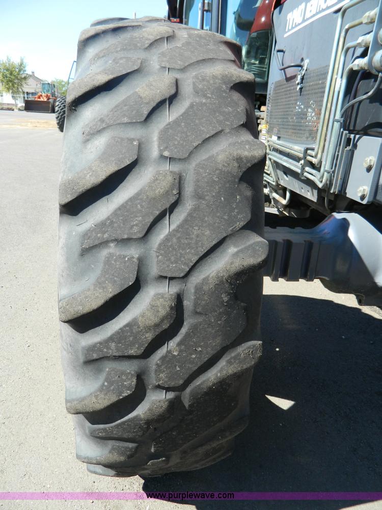 image for item E4190 2000 New Holland TV-140 bi-directional 4WD tractor