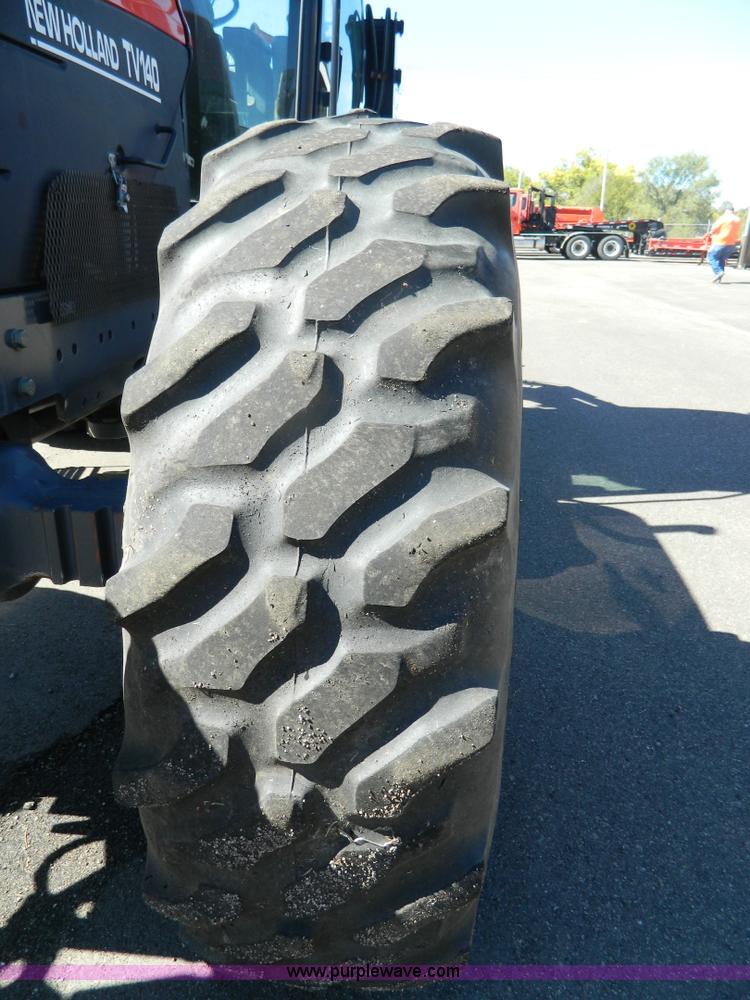 image for item E4190 2000 New Holland TV-140 bi-directional 4WD tractor