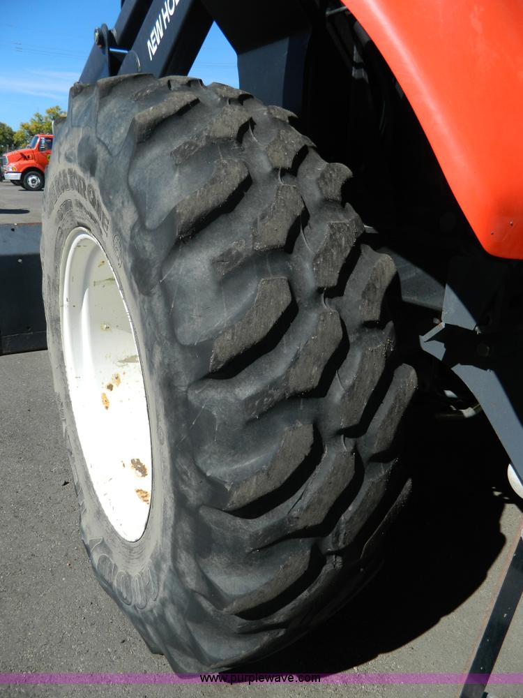 image for item E4190 2000 New Holland TV-140 bi-directional 4WD tractor