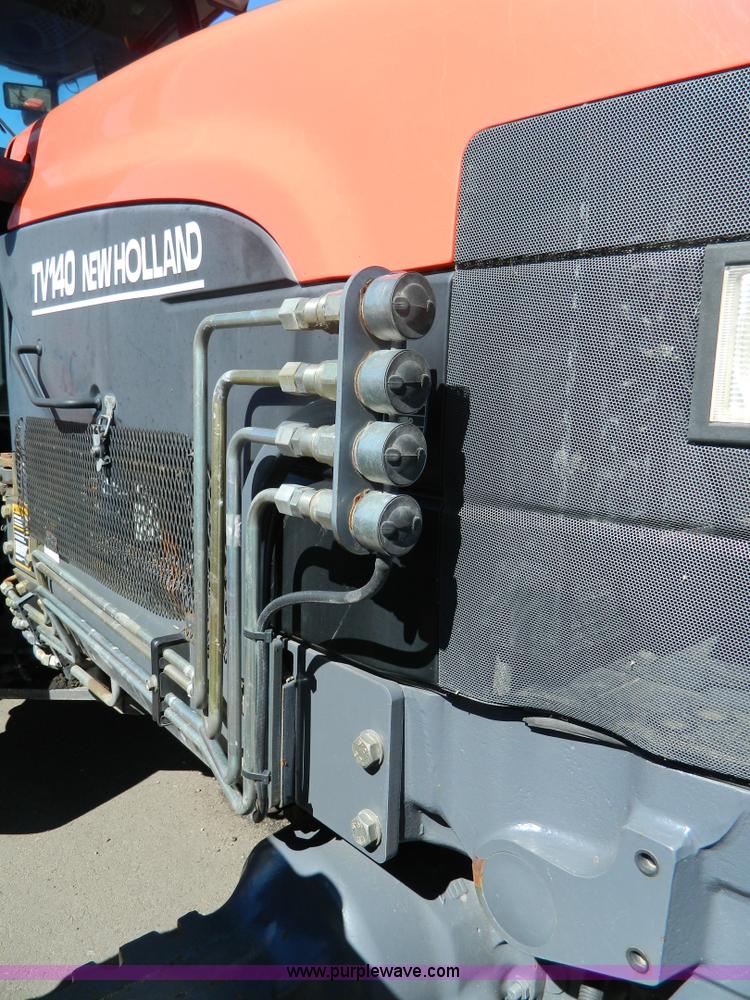 image for item E4190 2000 New Holland TV-140 bi-directional 4WD tractor