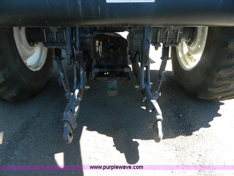 image for item E4190 2000 New Holland TV-140 bi-directional 4WD tractor