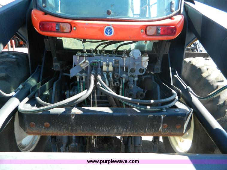 image for item E4190 2000 New Holland TV-140 bi-directional 4WD tractor