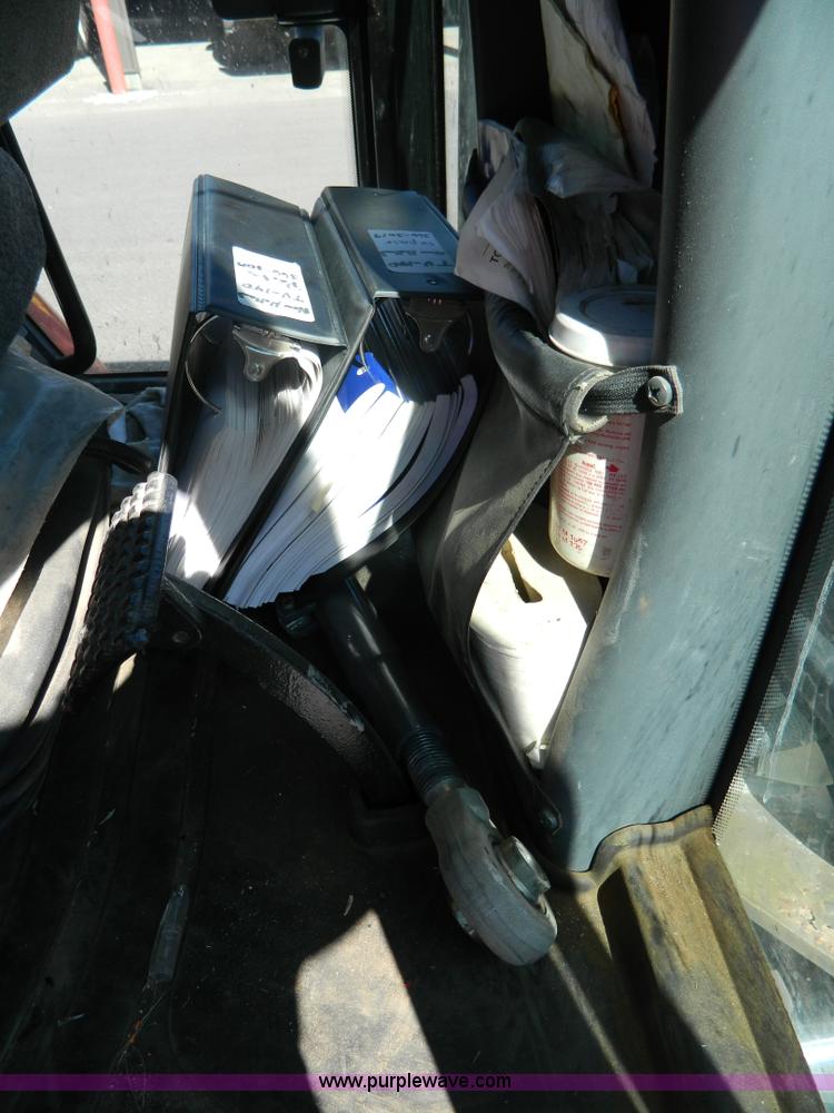 image for item E4190 2000 New Holland TV-140 bi-directional 4WD tractor