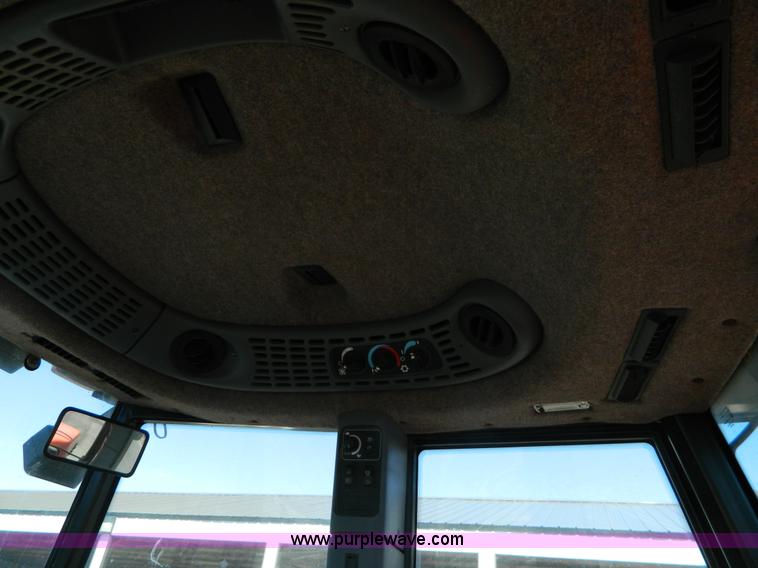 image for item E4190 2000 New Holland TV-140 bi-directional 4WD tractor