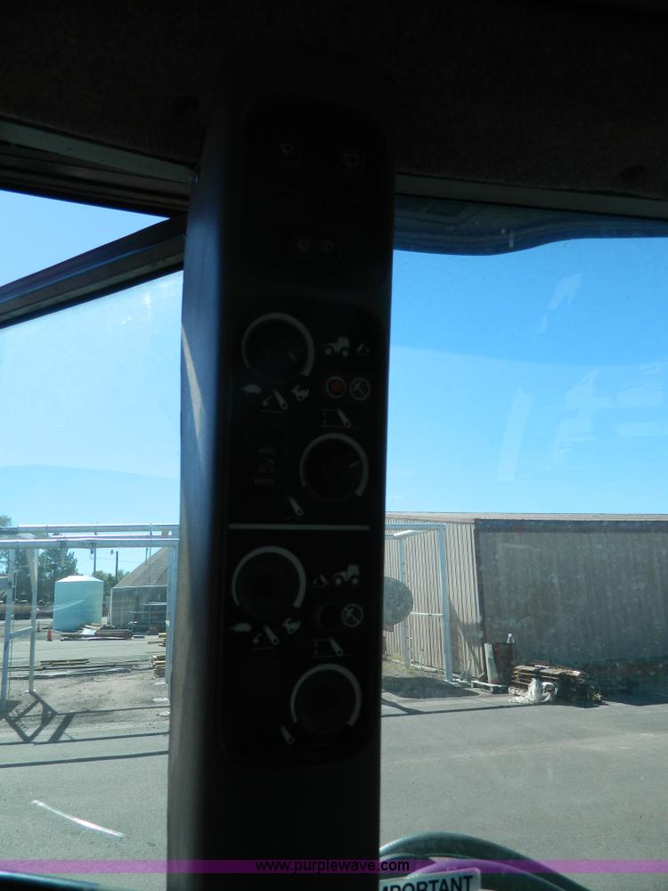 image for item E4190 2000 New Holland TV-140 bi-directional 4WD tractor