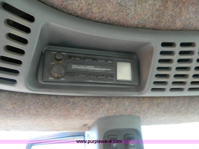 image for item E4190 2000 New Holland TV-140 bi-directional 4WD tractor