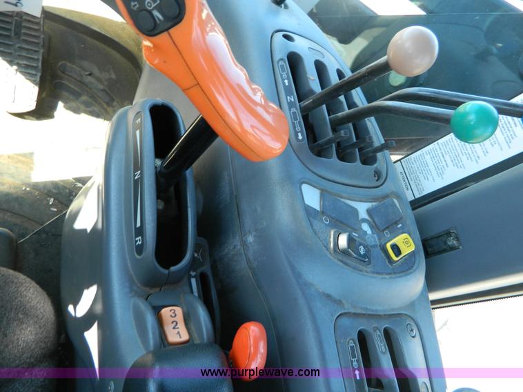 image for item E4190 2000 New Holland TV-140 bi-directional 4WD tractor