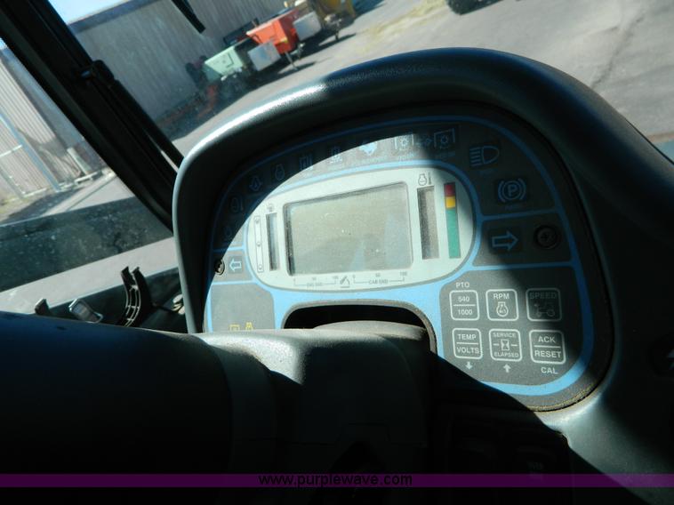 image for item E4190 2000 New Holland TV-140 bi-directional 4WD tractor