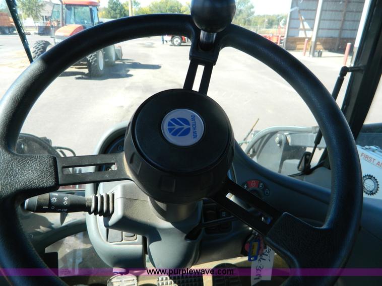 image for item E4190 2000 New Holland TV-140 bi-directional 4WD tractor