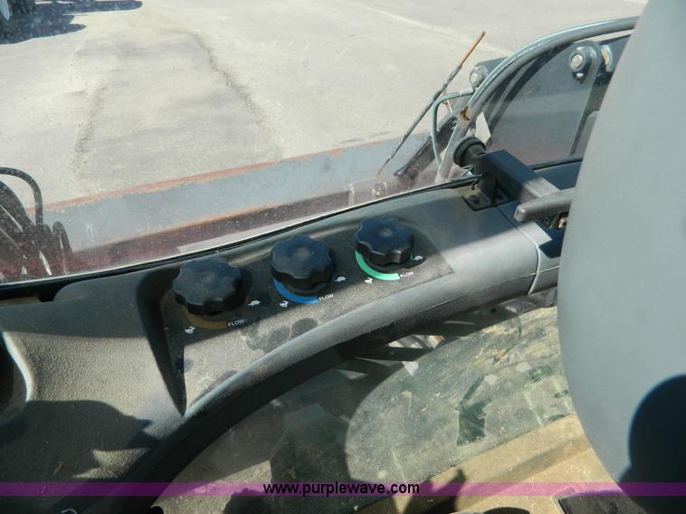 image for item E4190 2000 New Holland TV-140 bi-directional 4WD tractor