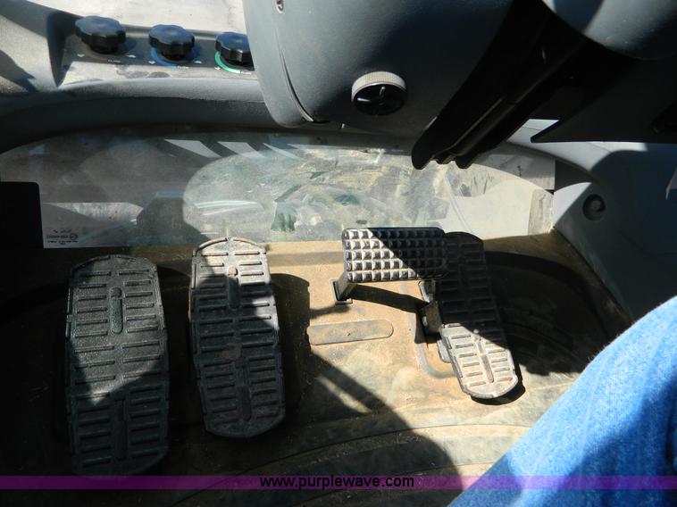 image for item E4190 2000 New Holland TV-140 bi-directional 4WD tractor