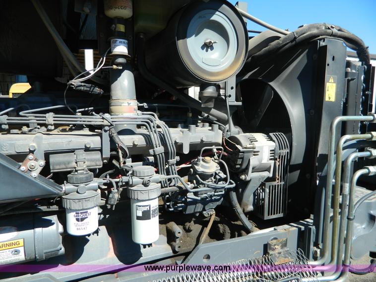 image for item E4190 2000 New Holland TV-140 bi-directional 4WD tractor