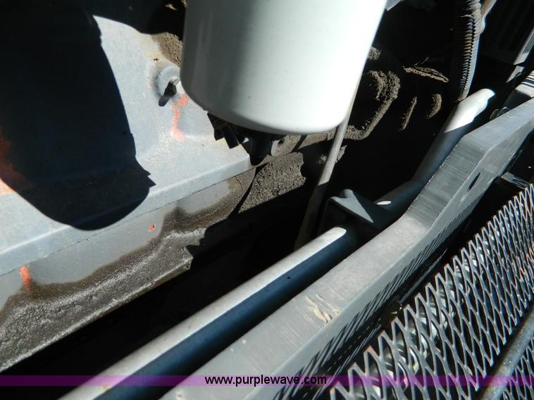 image for item E4190 2000 New Holland TV-140 bi-directional 4WD tractor