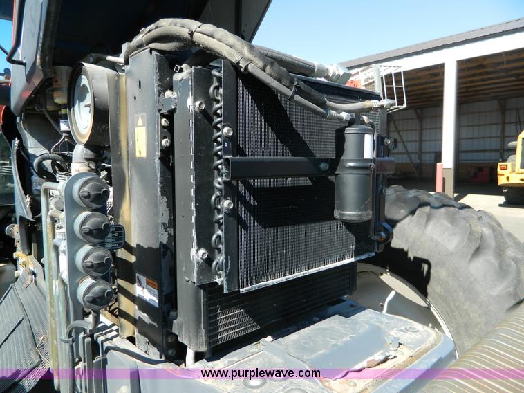 image for item E4190 2000 New Holland TV-140 bi-directional 4WD tractor