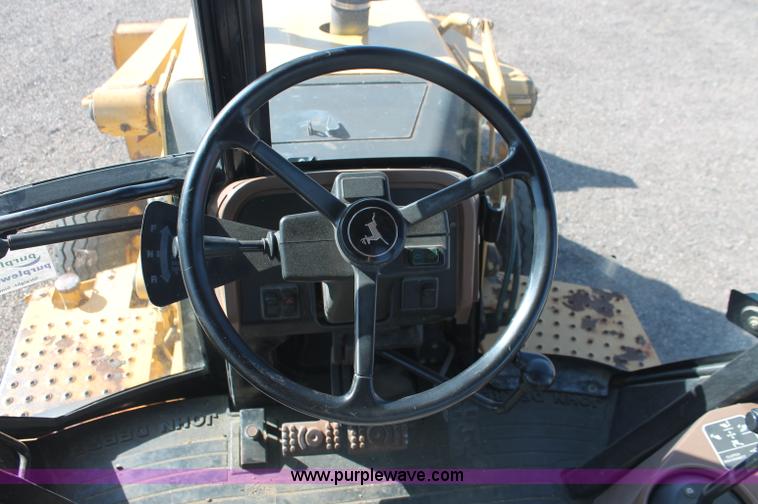 image for item F6142 1997 John Deere 310E backhoe