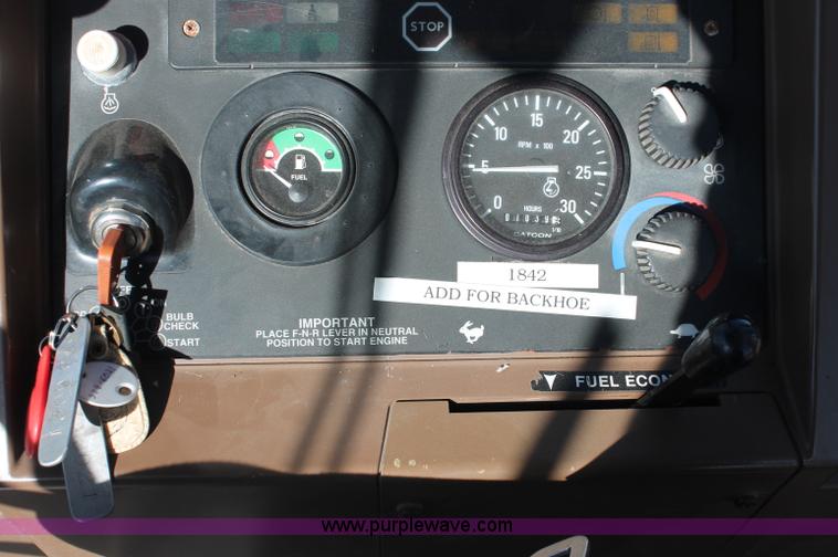 image for item F6142 1997 John Deere 310E backhoe