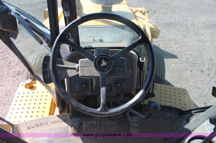 image for item F6145 1997 John Deere 310E backhoe