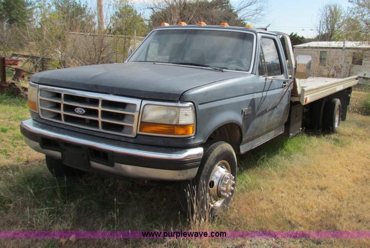 image for item B1659 1994 Ford Super Duty XLT roll back truck