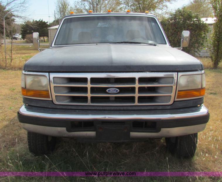 image for item B1659 1994 Ford Super Duty XLT roll back truck