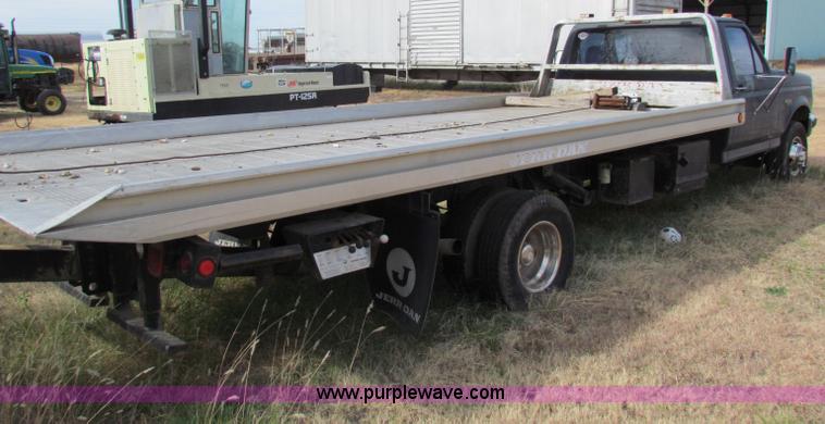 image for item B1659 1994 Ford Super Duty XLT roll back truck