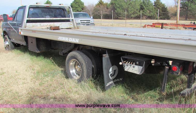 image for item B1659 1994 Ford Super Duty XLT roll back truck