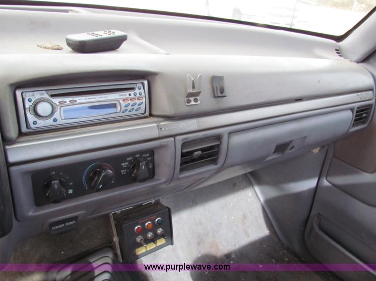 image for item B1659 1994 Ford Super Duty XLT roll back truck