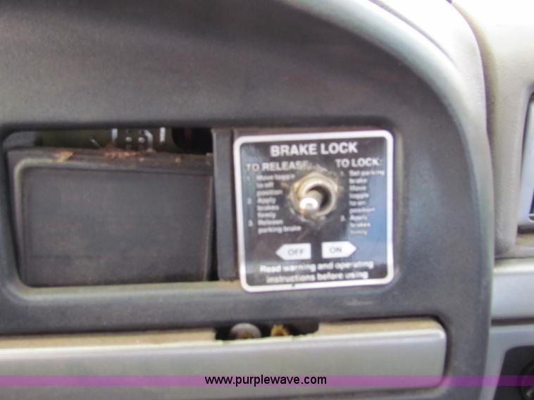 image for item B1659 1994 Ford Super Duty XLT roll back truck