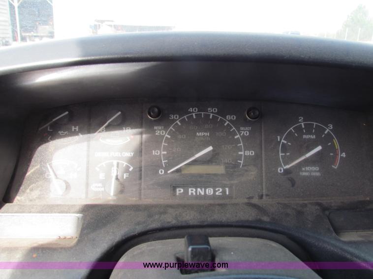 image for item B1659 1994 Ford Super Duty XLT roll back truck