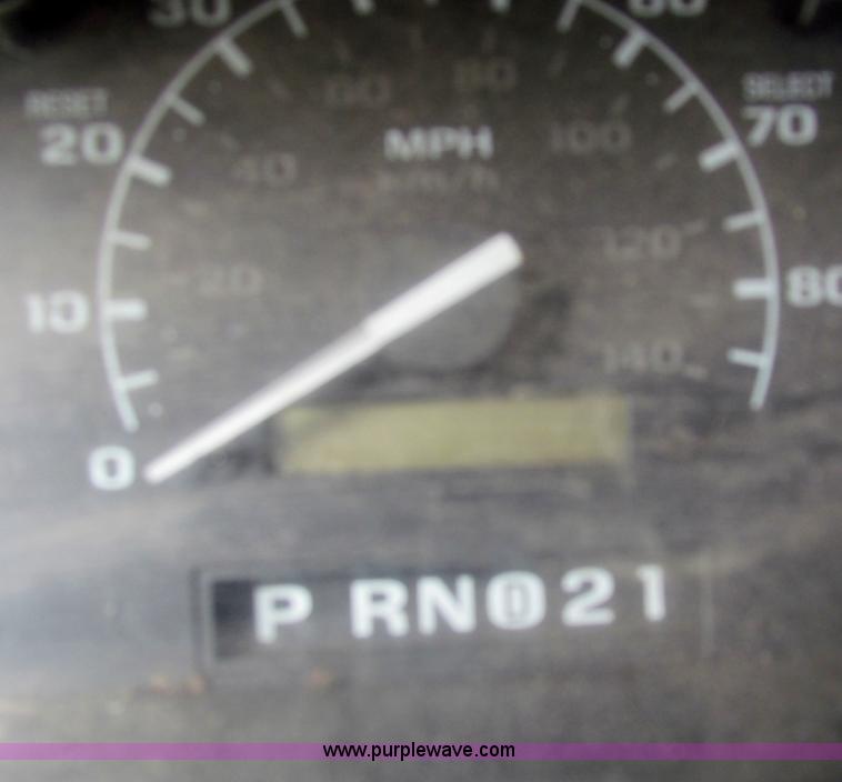 image for item B1659 1994 Ford Super Duty XLT roll back truck