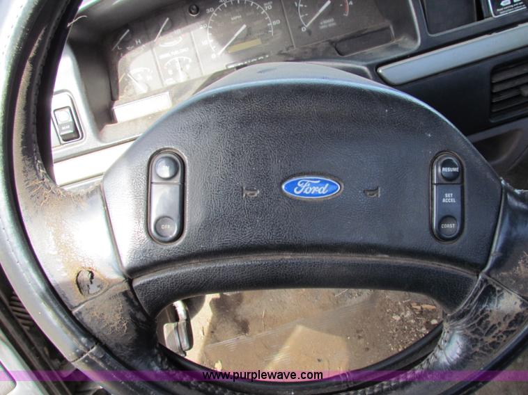 image for item B1659 1994 Ford Super Duty XLT roll back truck