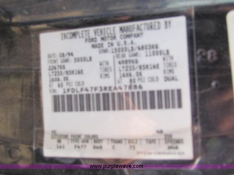 image for item B1659 1994 Ford Super Duty XLT roll back truck