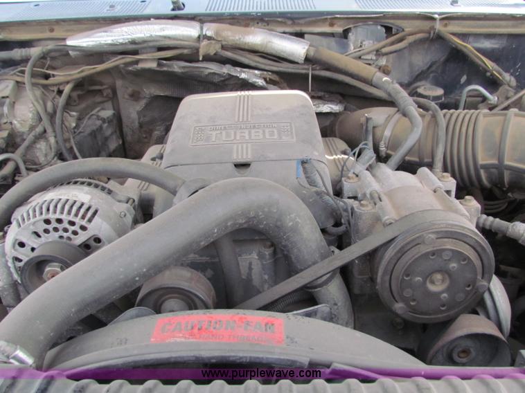 image for item B1659 1994 Ford Super Duty XLT roll back truck