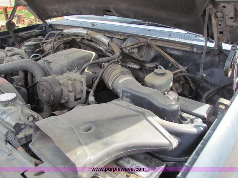 image for item B1659 1994 Ford Super Duty XLT roll back truck